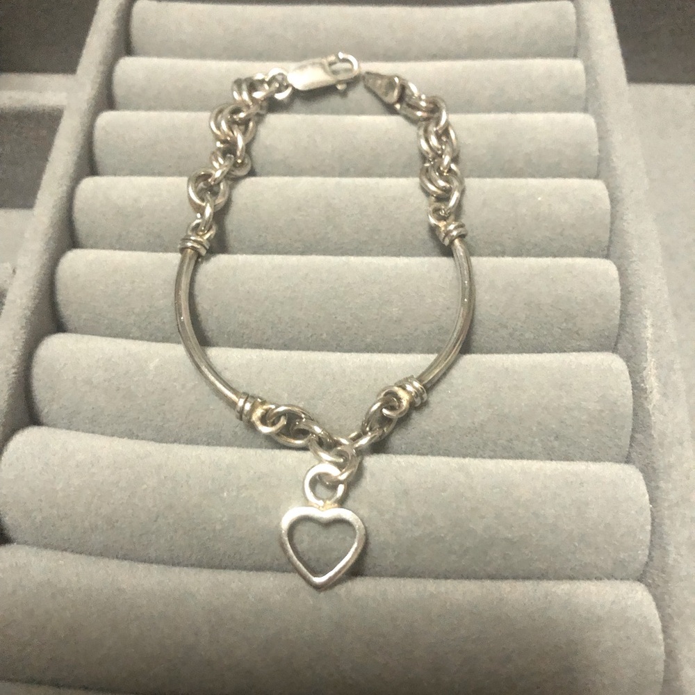 Silver bracelet pre owned with heart charm.
